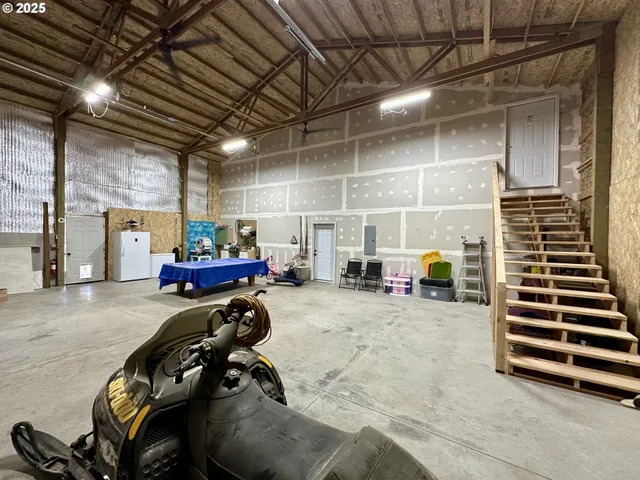 a view of a gym with equipment in it