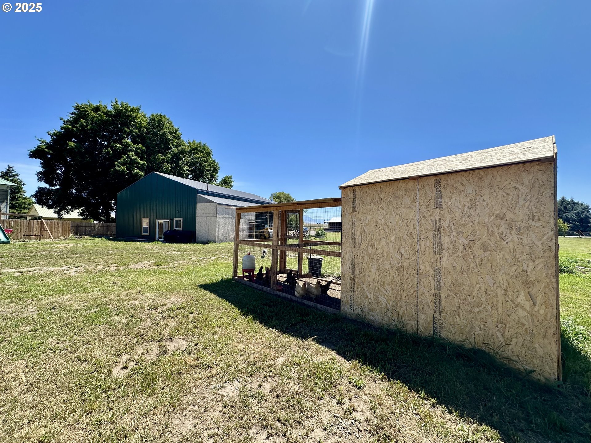 416 4th Street Summerville, OR 97876 - Photo 30 of 40 a backyard of a house with table and chairs