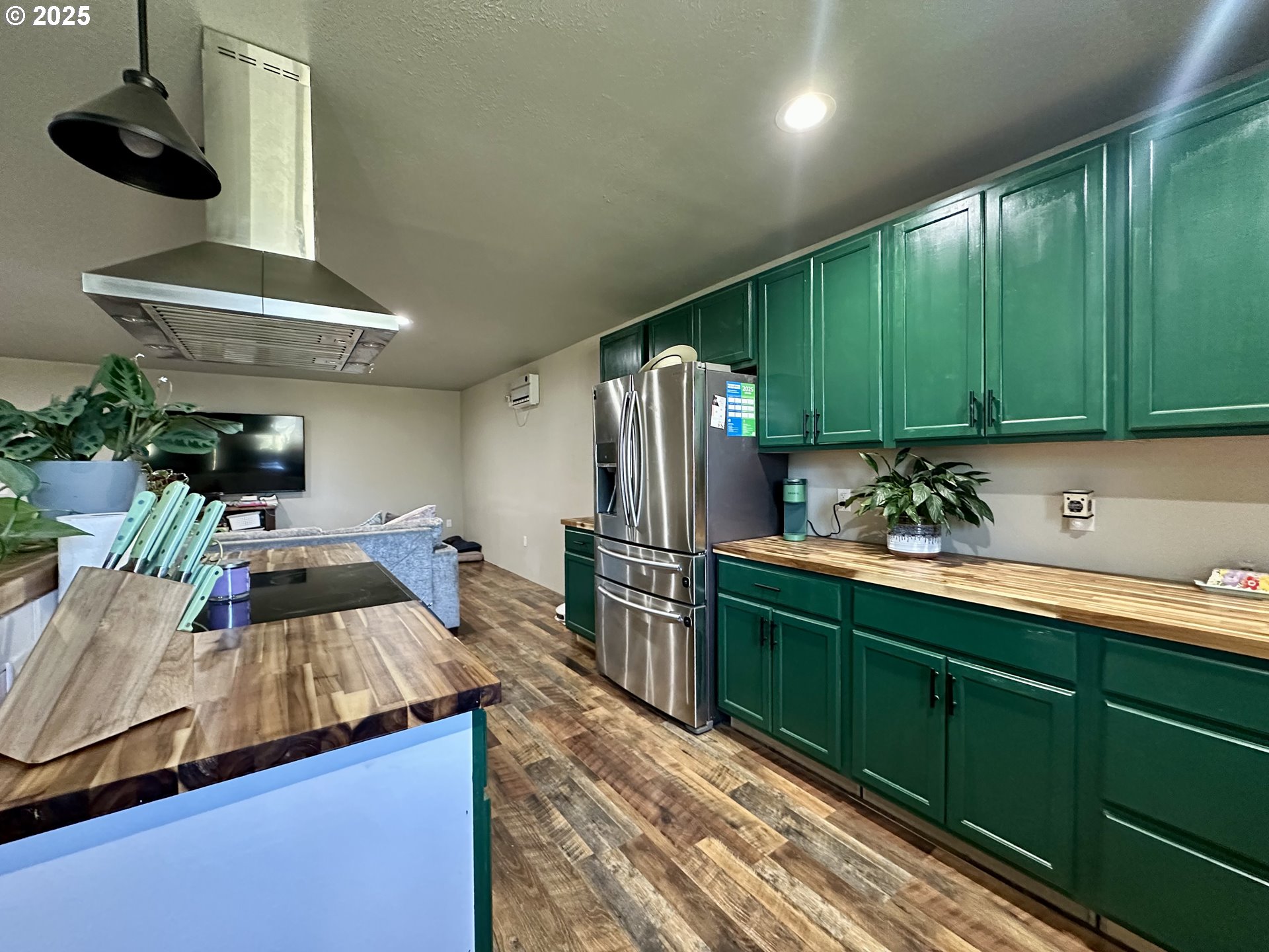 416 4th Street Summerville, OR 97876 - Photo 3 of 40 a kitchen with kitchen island stainless steel appliances a sink stove and refrigerator