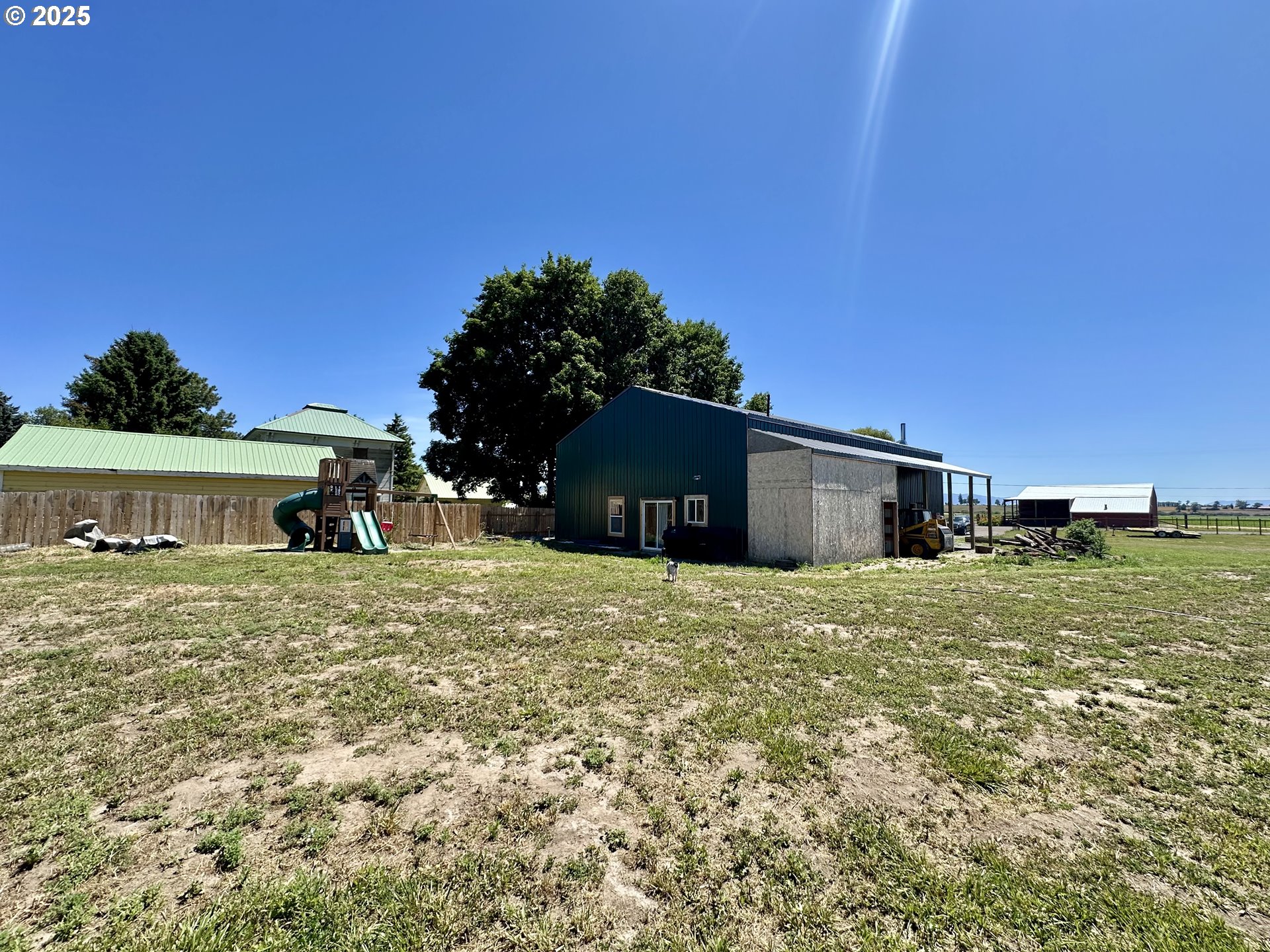 416 4th Street Summerville, OR 97876 - Photo 31 of 40 a big house with big yard plants and large trees