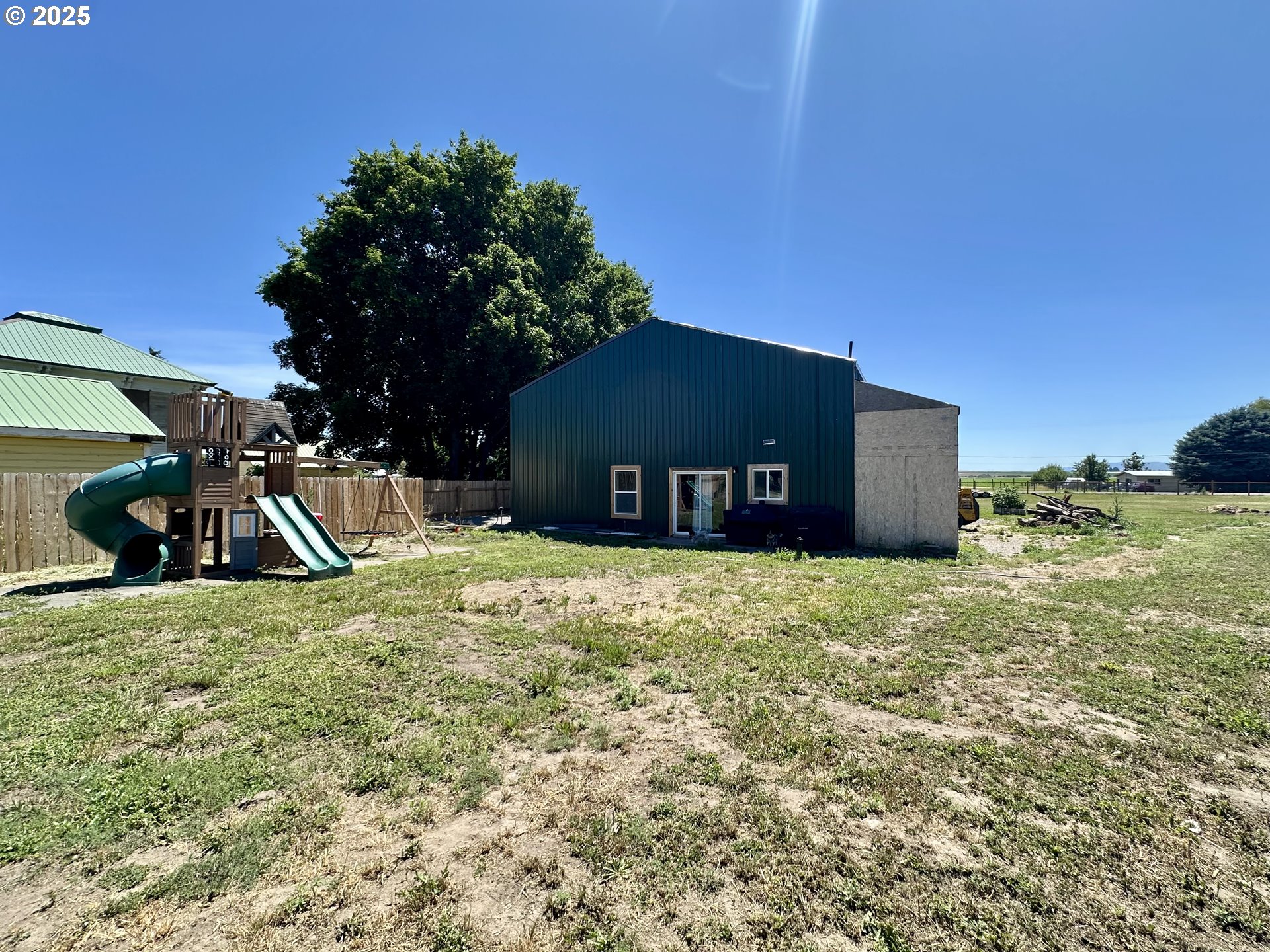 416 4th Street Summerville, OR 97876 - Photo 32 of 40 a view of a wooden house with a yard
