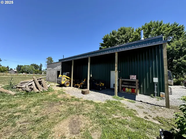 a view of a chairs and table in a patio