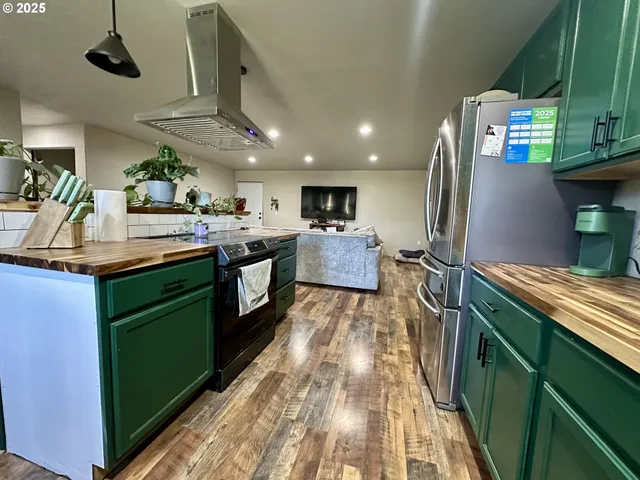 a kitchen with stainless steel appliances granite countertop lots of counter top space