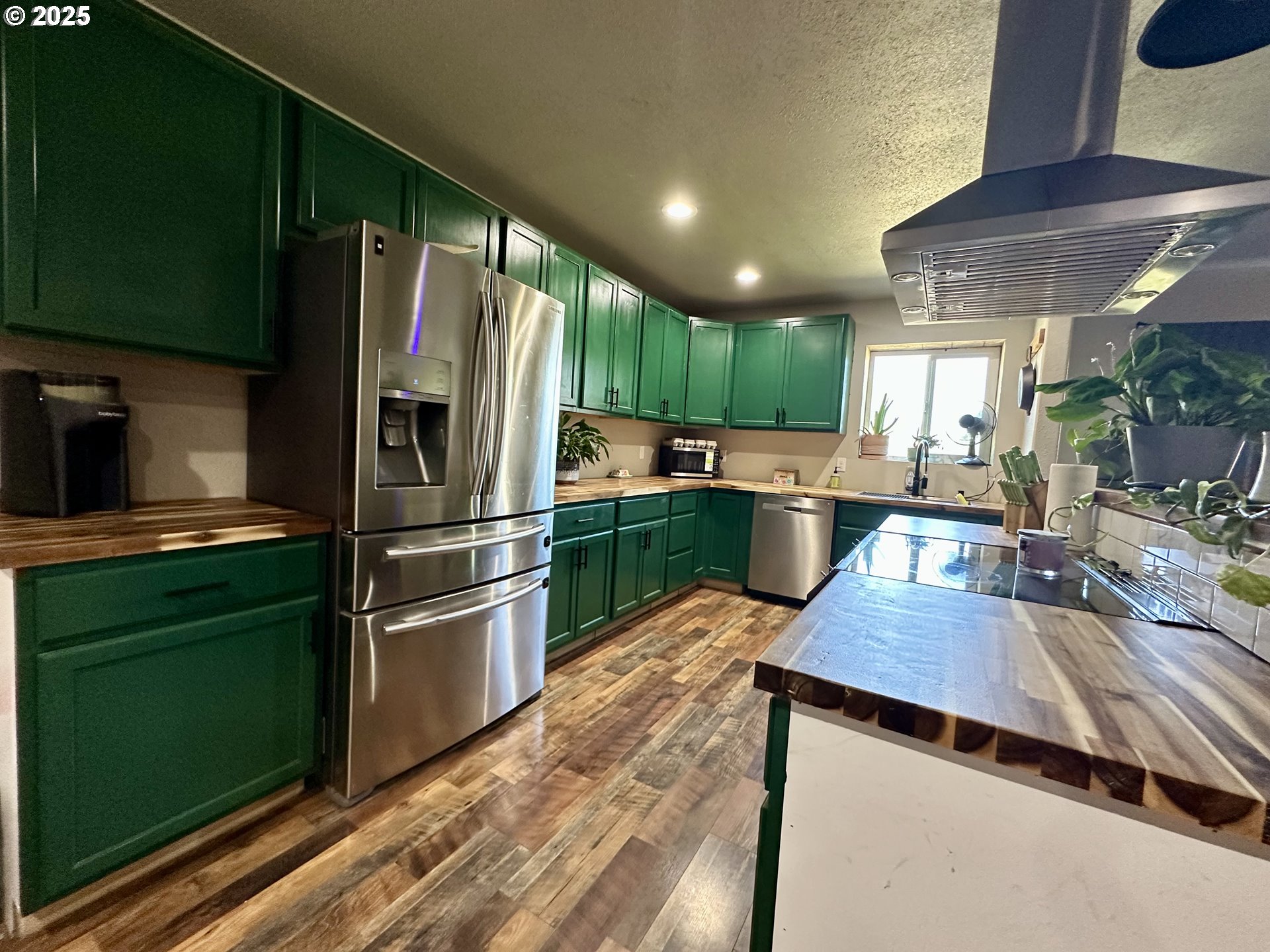 416 4th Street Summerville, OR 97876 - Photo 5 of 40 a kitchen with kitchen island a counter top space a refrigerator and a sink