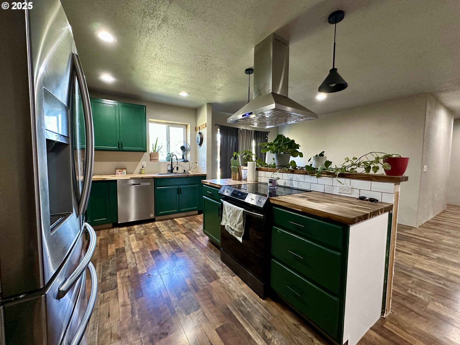 416 4th Street Summerville, OR 97876 - Photo 7 of 40 a kitchen with a stove and cabinets