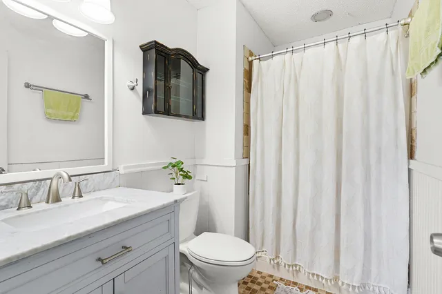 a view of a wooden fence and a pot