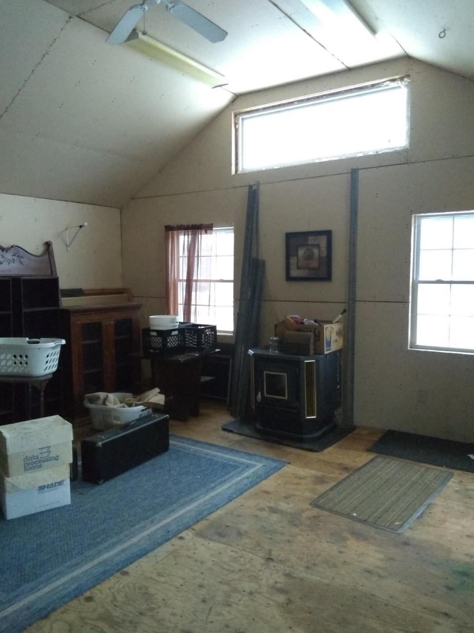 240 Haines Corner Road Livermore Falls, ME 04254 - Photo 20 of 40 0341 family room pellet stove