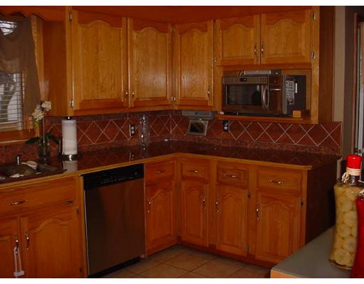 252 Oak Street Springfield, MA 01151 - Photo 2 of 10 a kitchen with stainless steel appliances a stove a microwave oven and a sink
