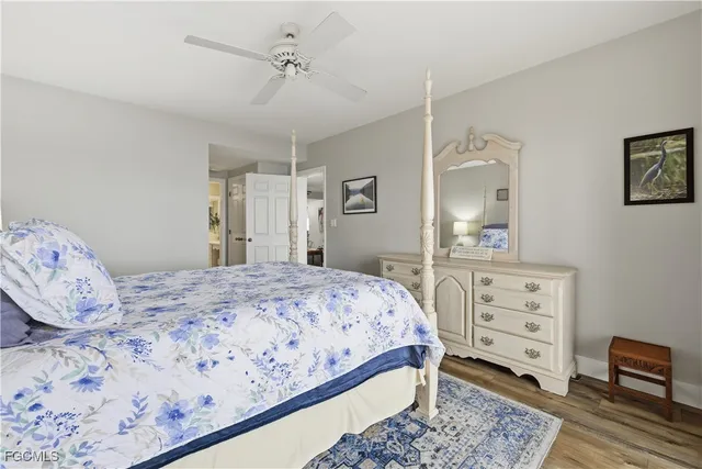 a bedroom with a bed and a dresser in it