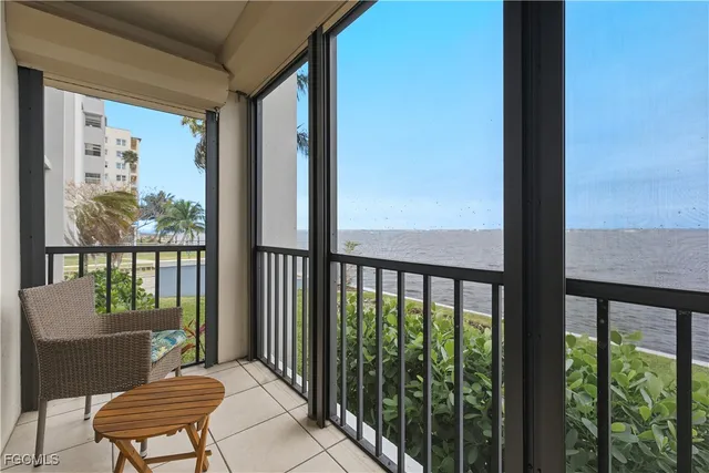 a view of a balcony with furniture