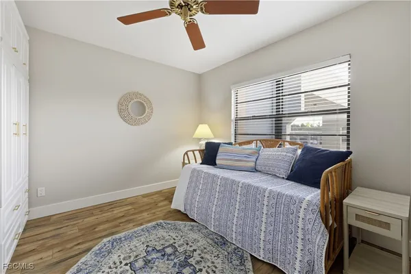 a bedroom with bed and window