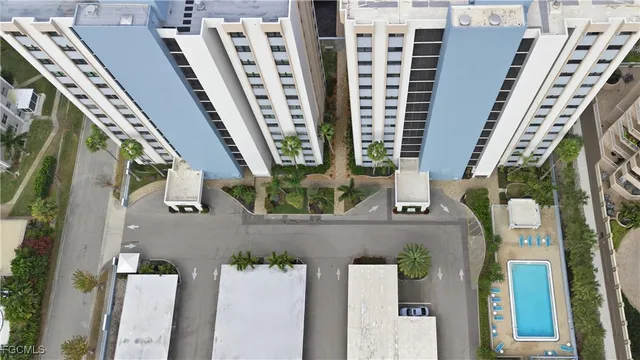 an aerial view of a residential apartment building with a street