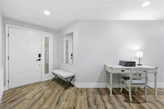 a bedroom with a bed and a table in it