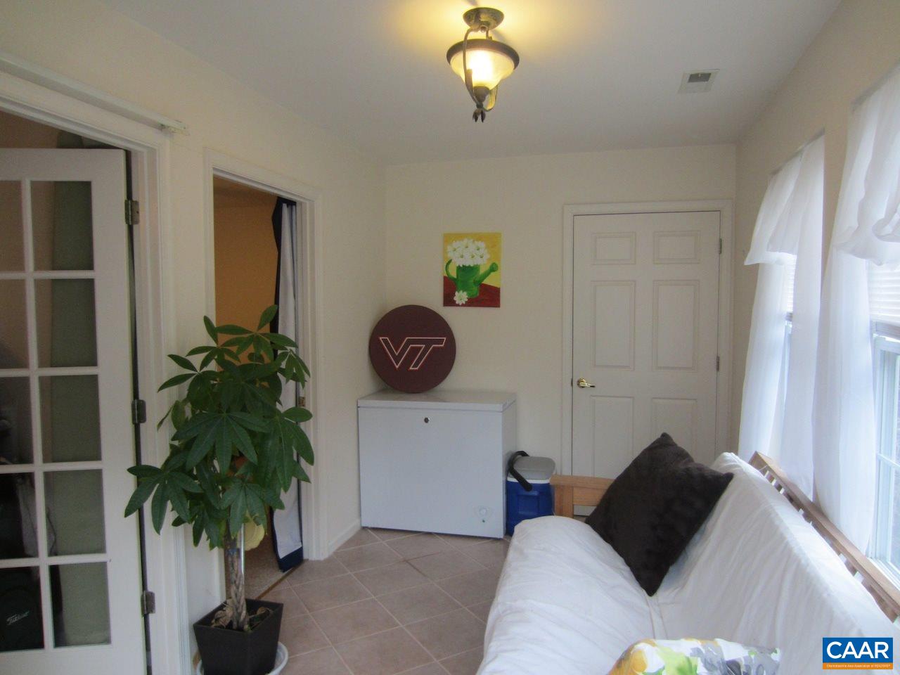 1420 Lilac Court Charlottesville, VA 22901 - Photo 12 of 15 a living room with furniture and a potted plant