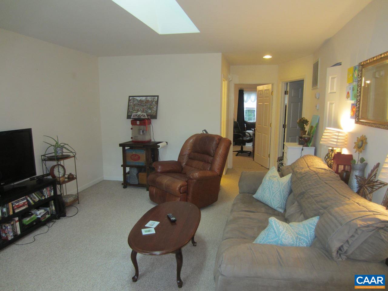 1420 Lilac Court Charlottesville, VA 22901 - Photo 2 of 15 a living room with furniture and a flat screen tv