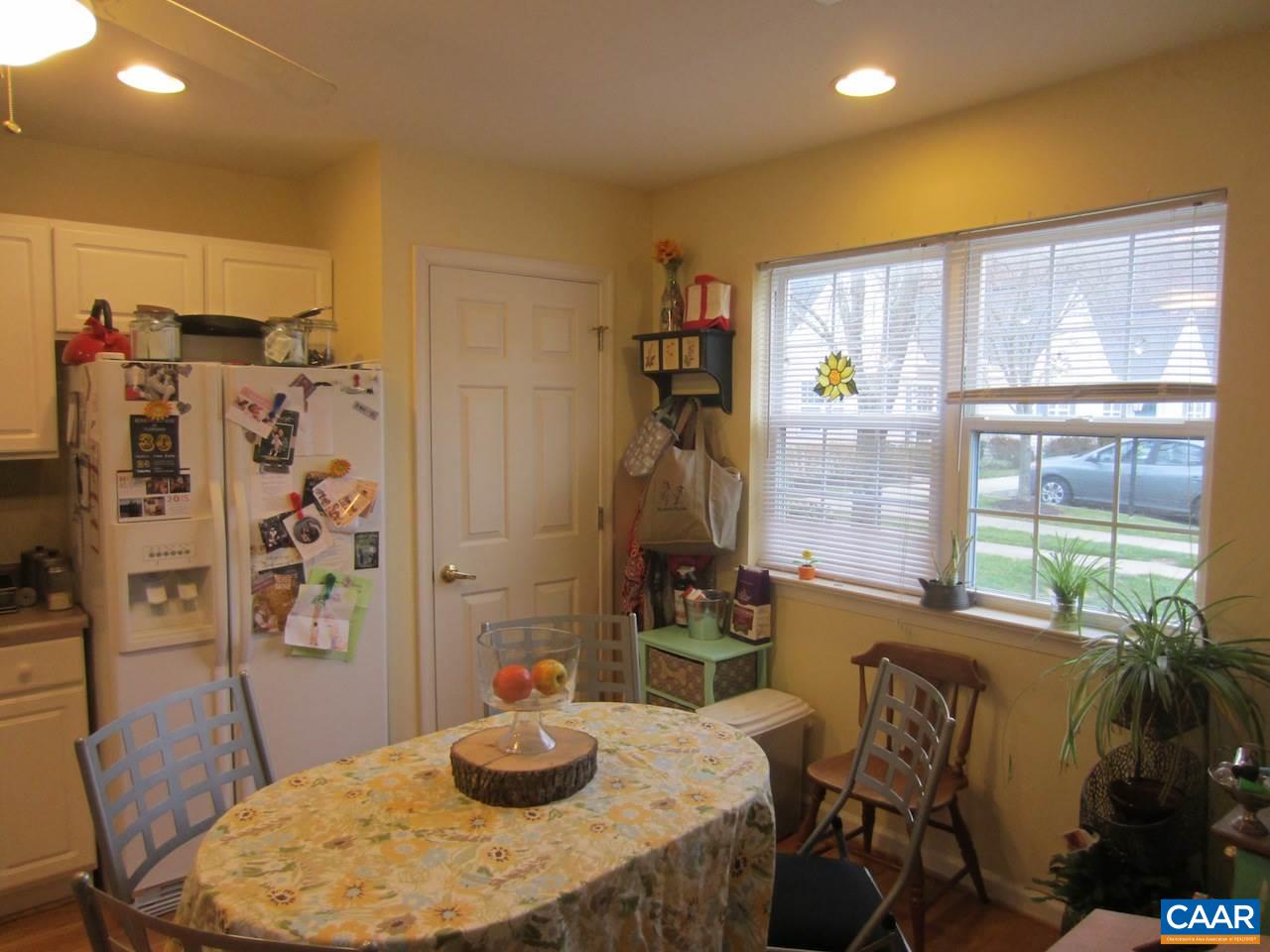 1420 Lilac Court Charlottesville, VA 22901 - Photo 5 of 15 a dining room with furniture a window and storage