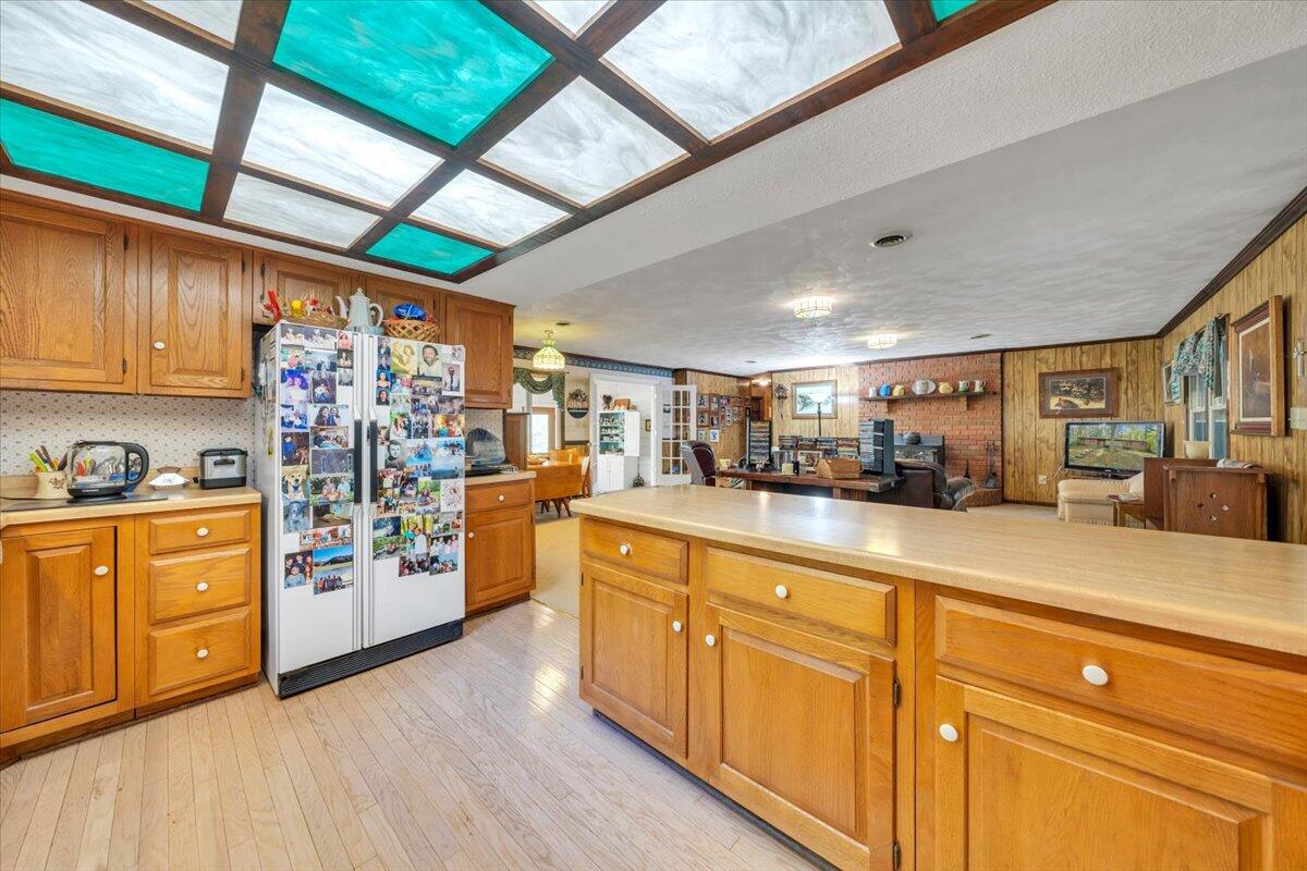 3878 Harborwood Road Salem, VA 24153 - Photo 23 of 60 a open kitchen with stainless steel appliances granite countertop a lot of counter space and wooden floors