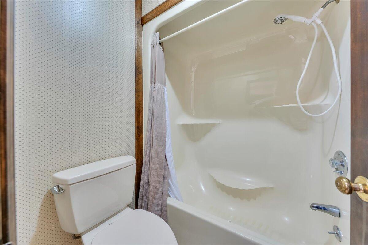 3878 Harborwood Road Salem, VA 24153 - Photo 33 of 60 a white toilet sitting next to a shower