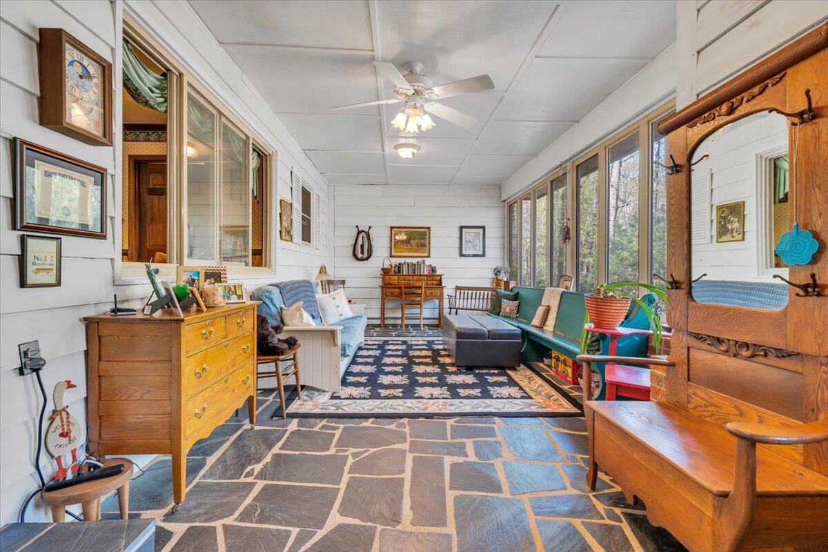 3878 Harborwood Road Salem, VA 24153 - Photo 6 of 60 a living room with furniture a chandelier and a rug