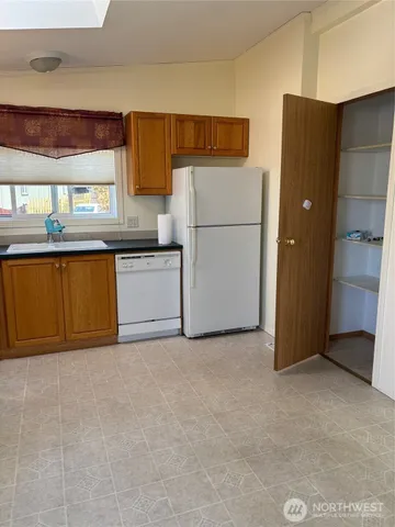 a spacious bathroom with a sink and a mirror