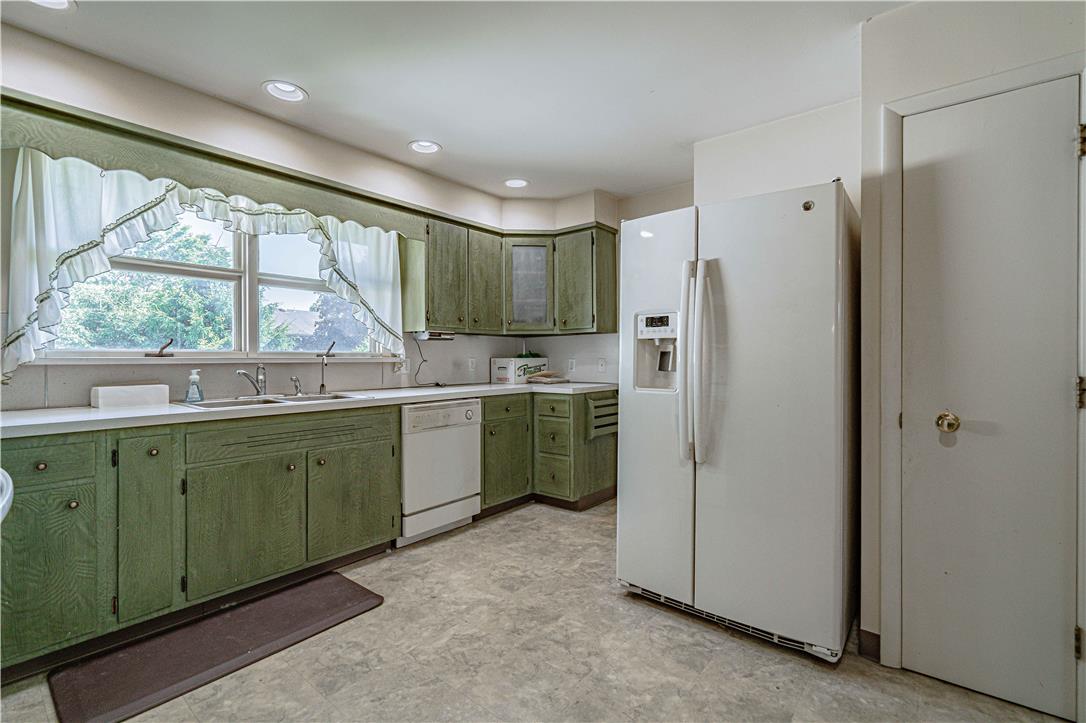 4815 Mill Road Schnecksville, PA 18078 - Photo 16 of 48 A well-equipped kitchen features ample cabinetry, a generous sink, and practical appliances, all bathed in natural light.
