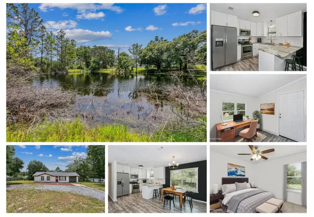 an aerial view of a house with a yard and lake view