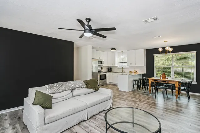 a living room with furniture and a large window