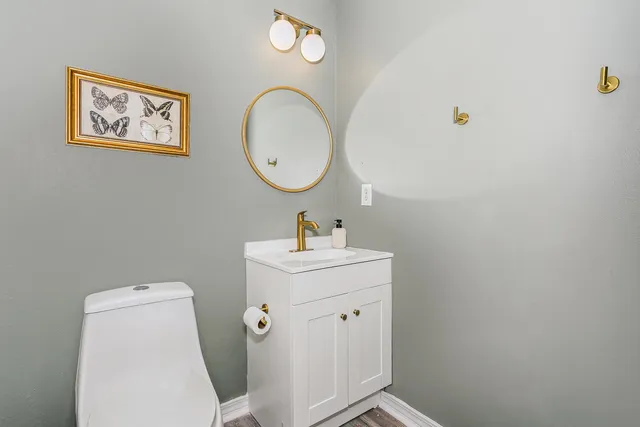 a white toilet sitting next to a shower curtain