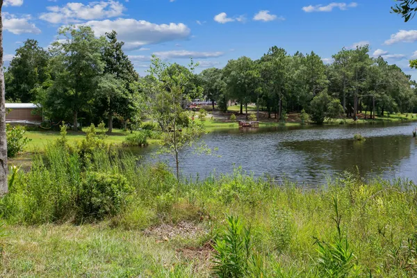 a view of a lake with a house in the background