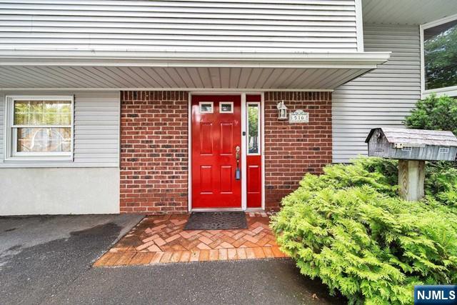 516 Knickerbocker Road Cresskill, NJ 07626 - Photo 31 of 31 a front view of a house with a garage