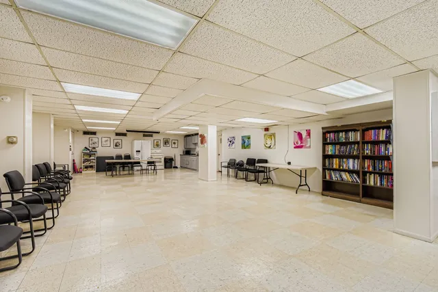 a room with furniture and white walls
