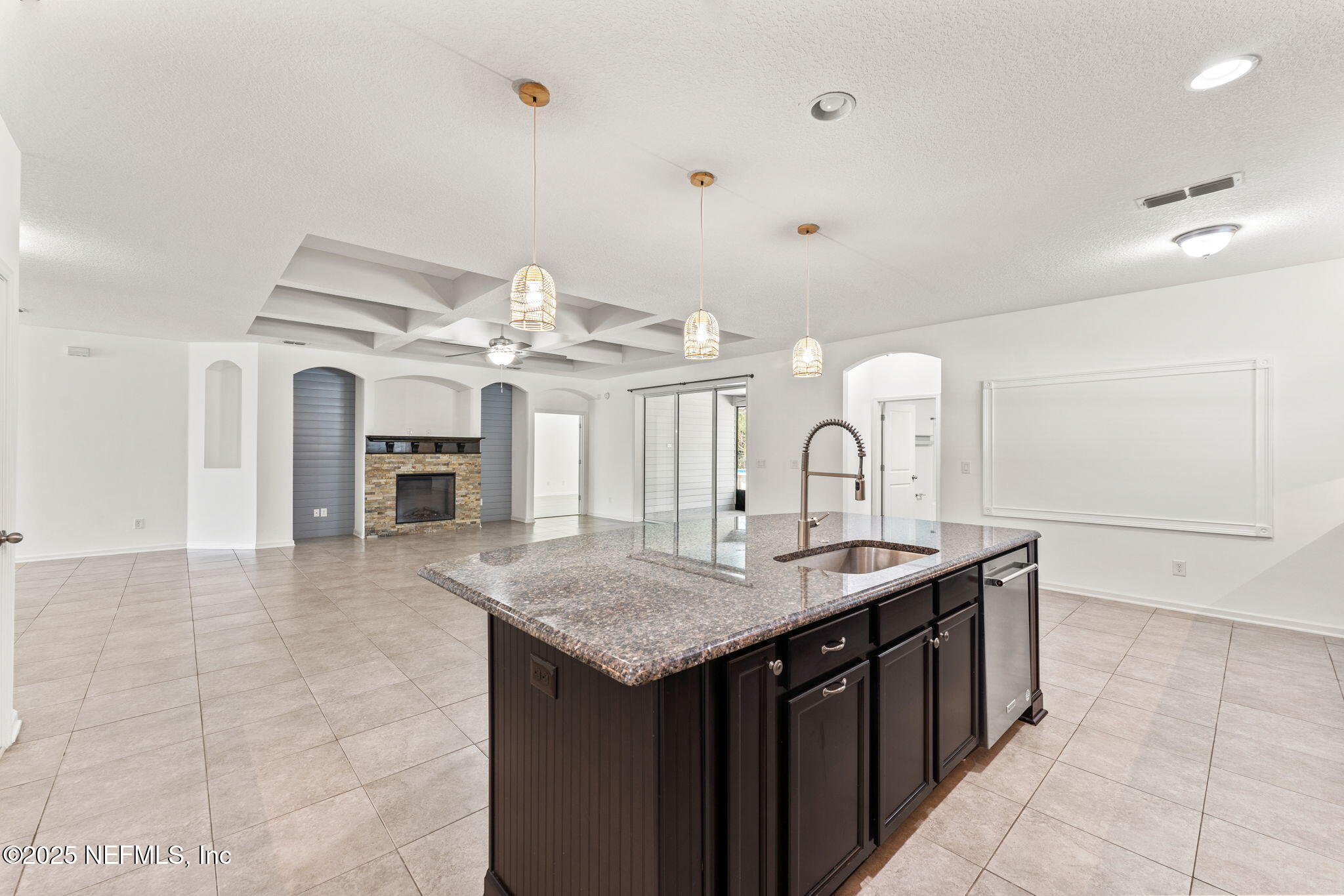 83029 Dowitcher Place Yulee, FL 32097 - Photo 11 of 40 a kitchen with a sink a counter and cabinets