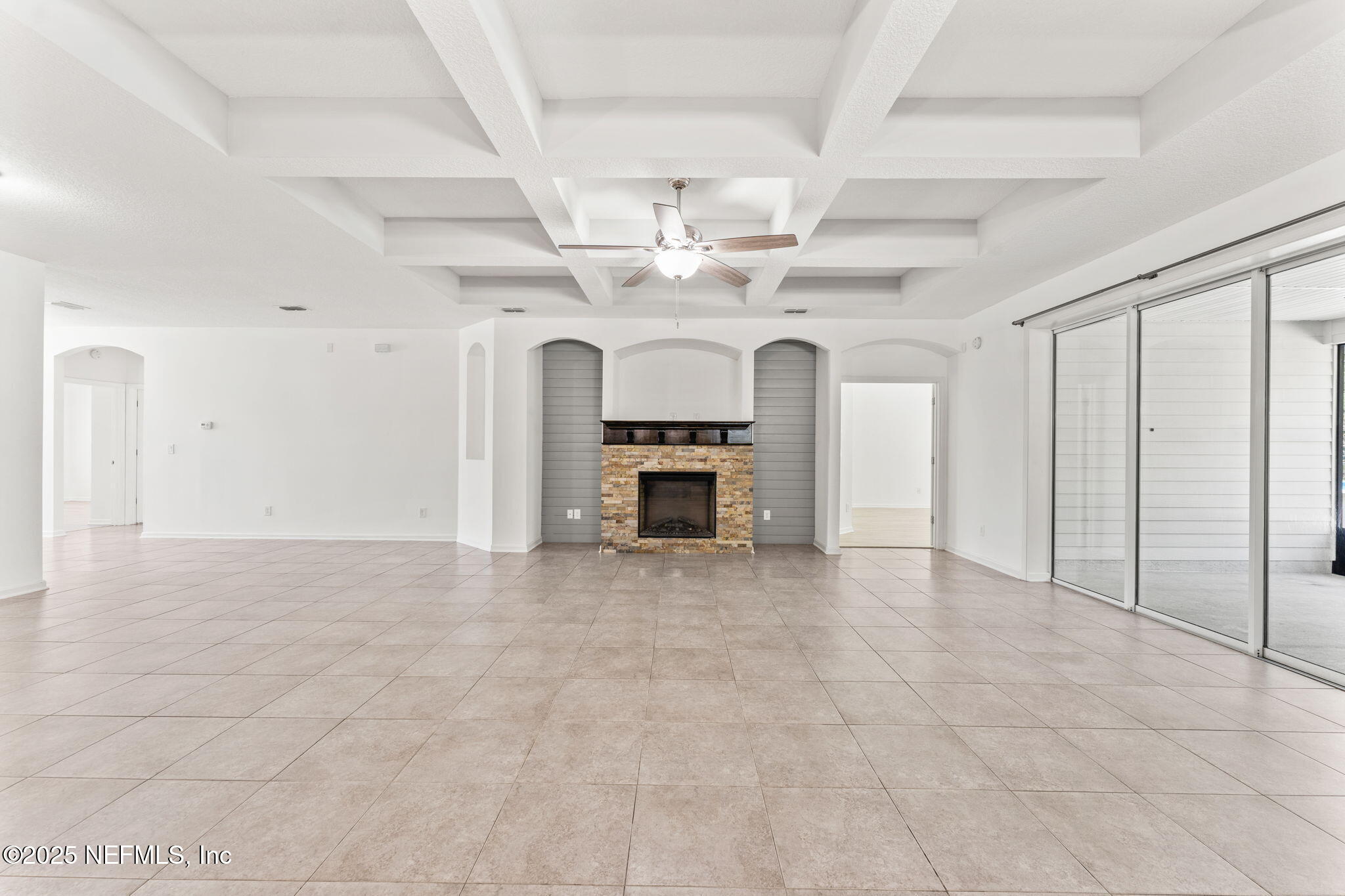 83029 Dowitcher Place Yulee, FL 32097 - Photo 14 of 40 wooden floor fireplace and windows in a room