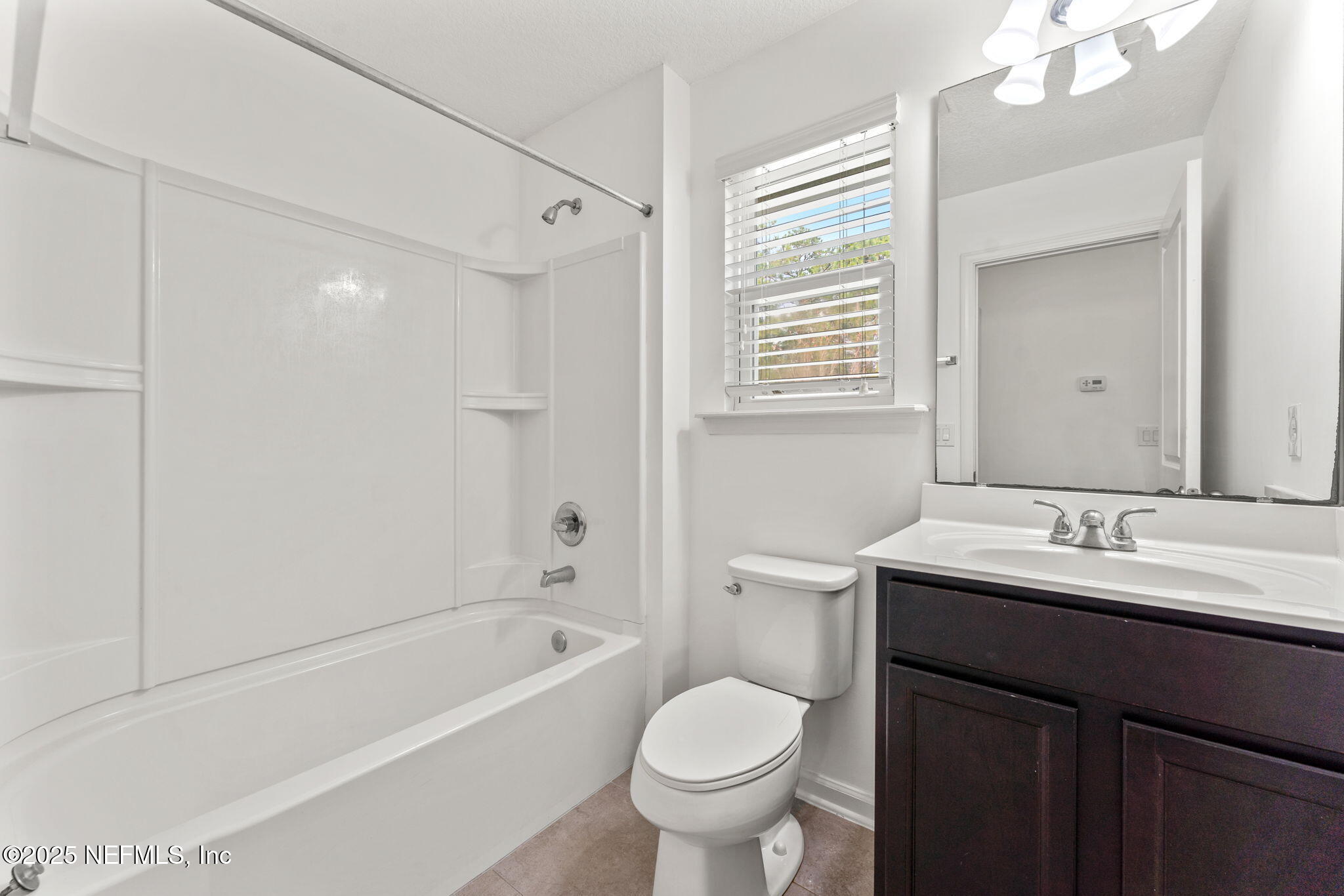 83029 Dowitcher Place Yulee, FL 32097 - Photo 16 of 40 a bathroom with a sink toilet tub and vanity