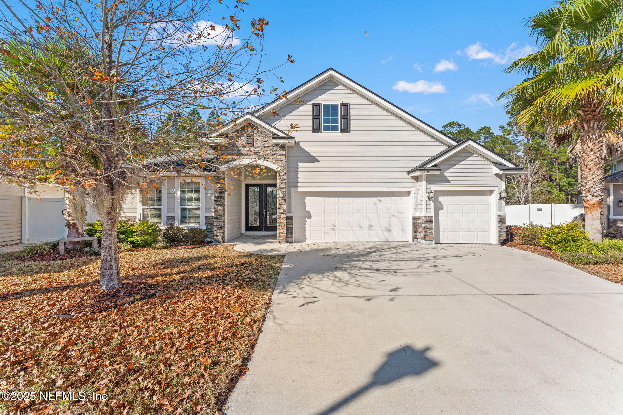 83029 Dowitcher Place Yulee, FL 32097 - Photo 2 of 40 a front view of a house with a yard