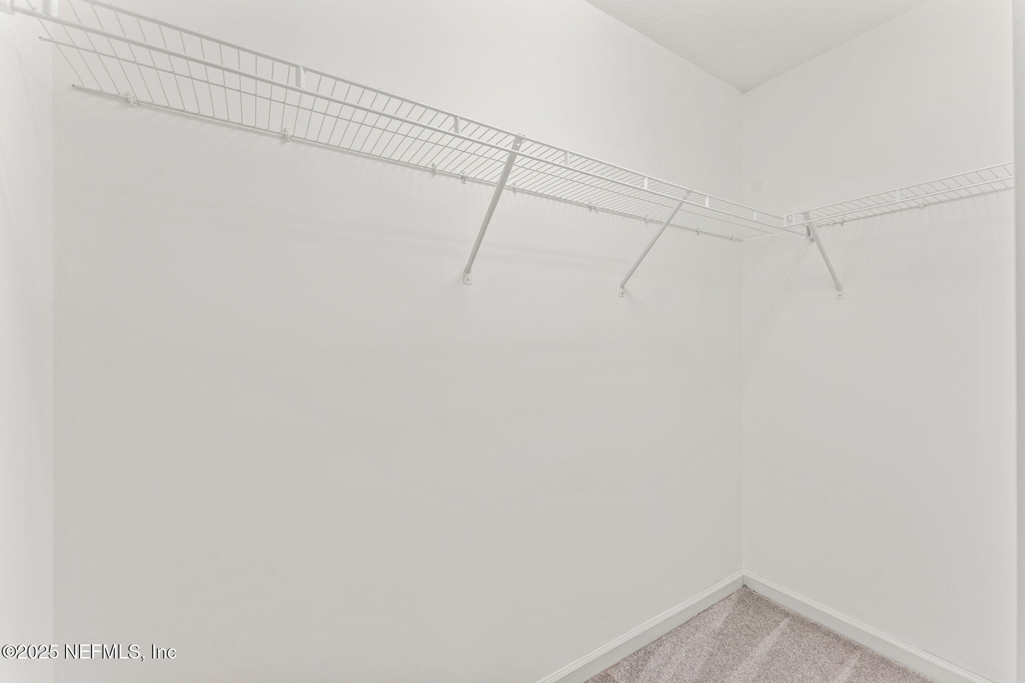 83029 Dowitcher Place Yulee, FL 32097 - Photo 30 of 40 a view of a room with racks on the wall