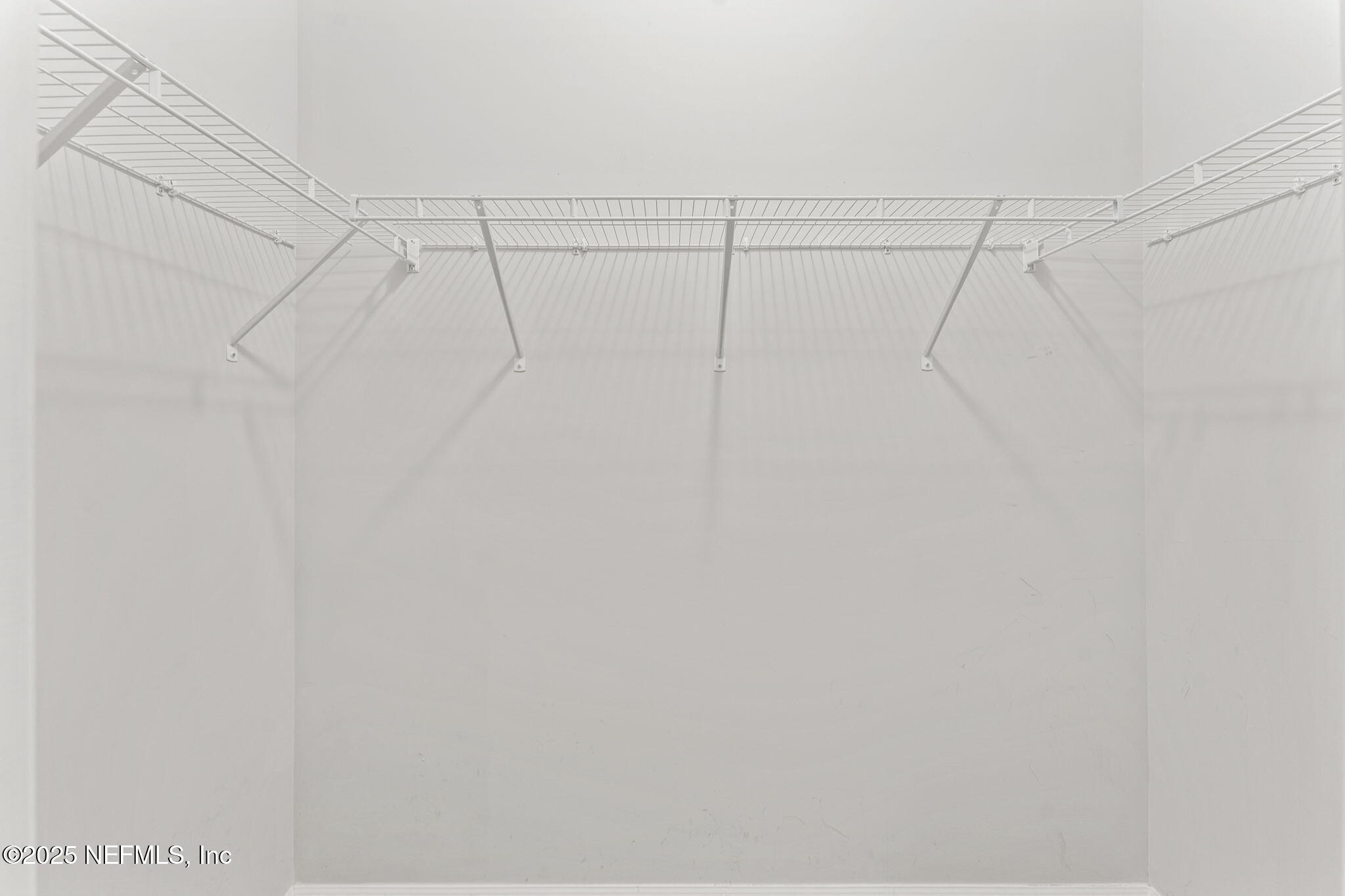 83029 Dowitcher Place Yulee, FL 32097 - Photo 31 of 40 a view of a room with racks on the wall