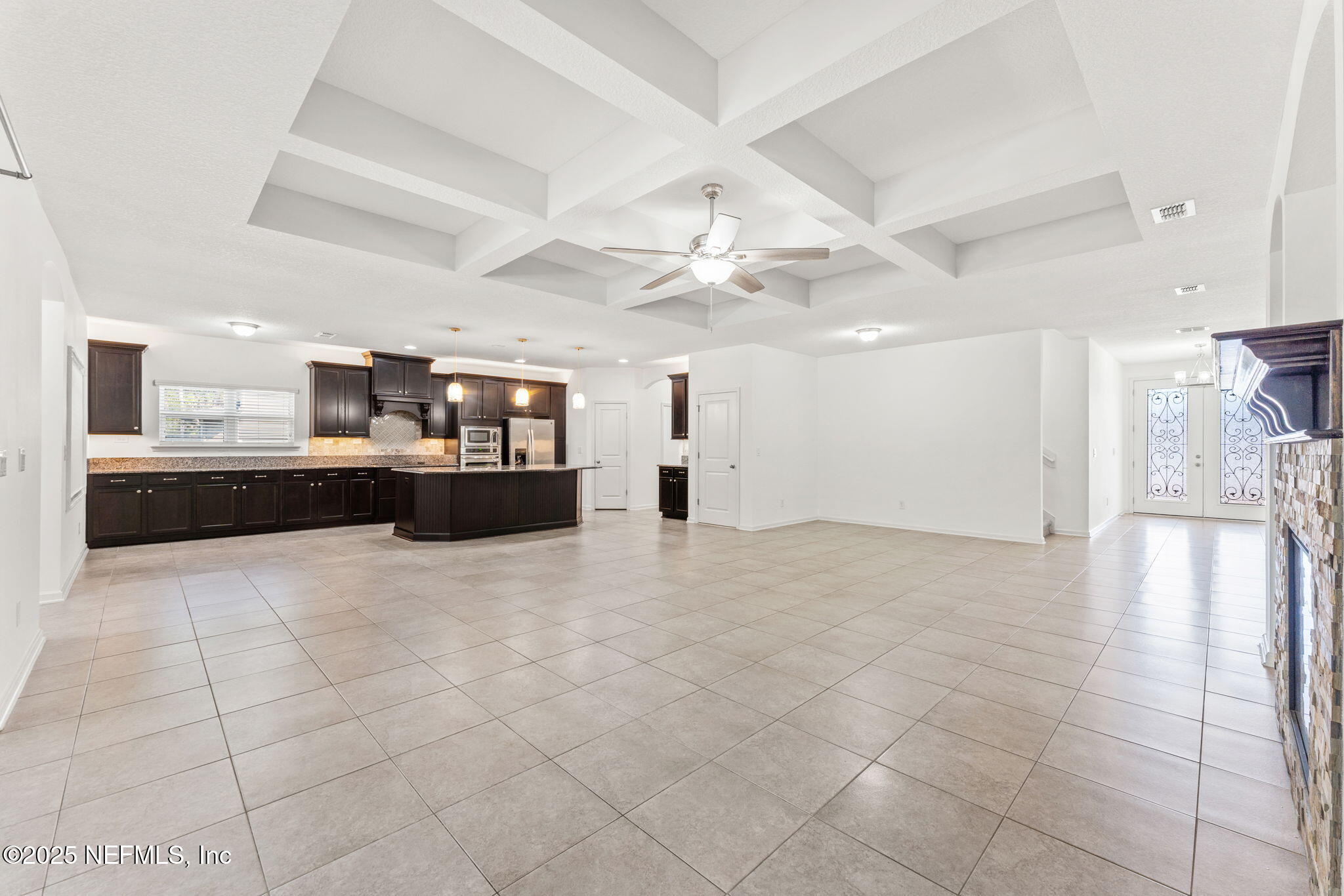 83029 Dowitcher Place Yulee, FL 32097 - Photo 7 of 40 a view of a kitchen with a stove and cabinets