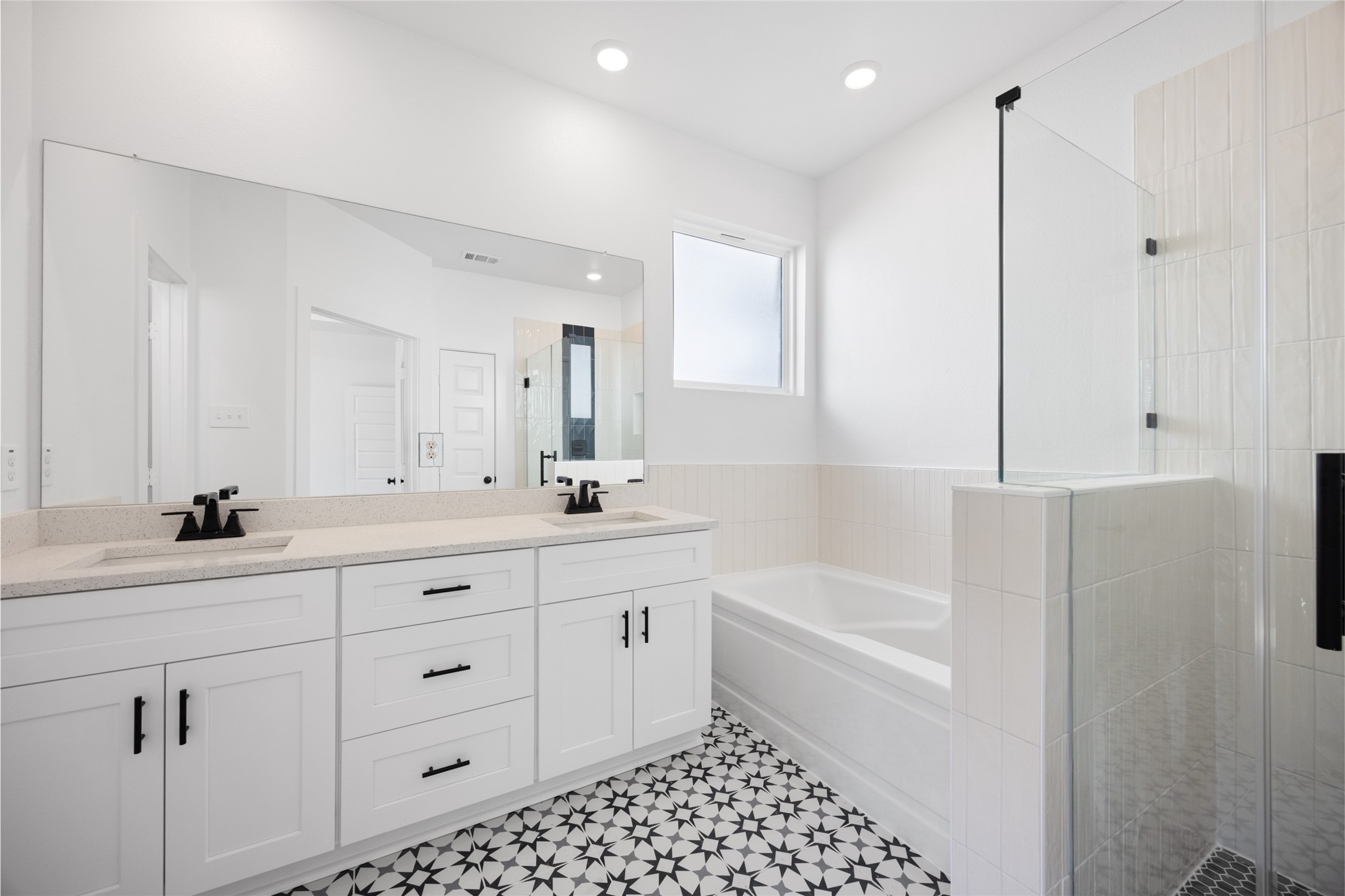 8326 Amethyst Valley Lane Angleton, TX 77515 - Photo 22 of 38 a bathroom with a double vanity sink a toilet a mirror and shower