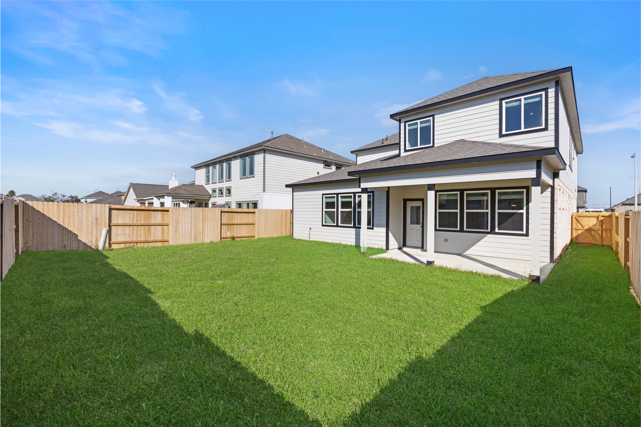 8326 Amethyst Valley Lane Angleton, TX 77515 - Photo 37 of 38 a view of a yard in front of a house with a large tree