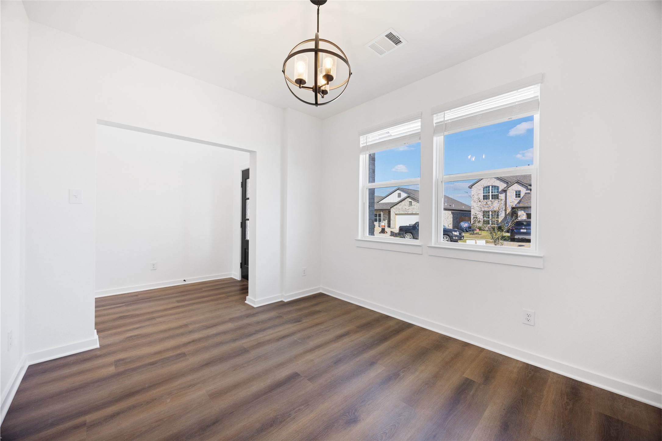 8326 Amethyst Valley Lane Angleton, TX 77515 - Photo 6 of 38 a view of an empty room with window and wooden floor