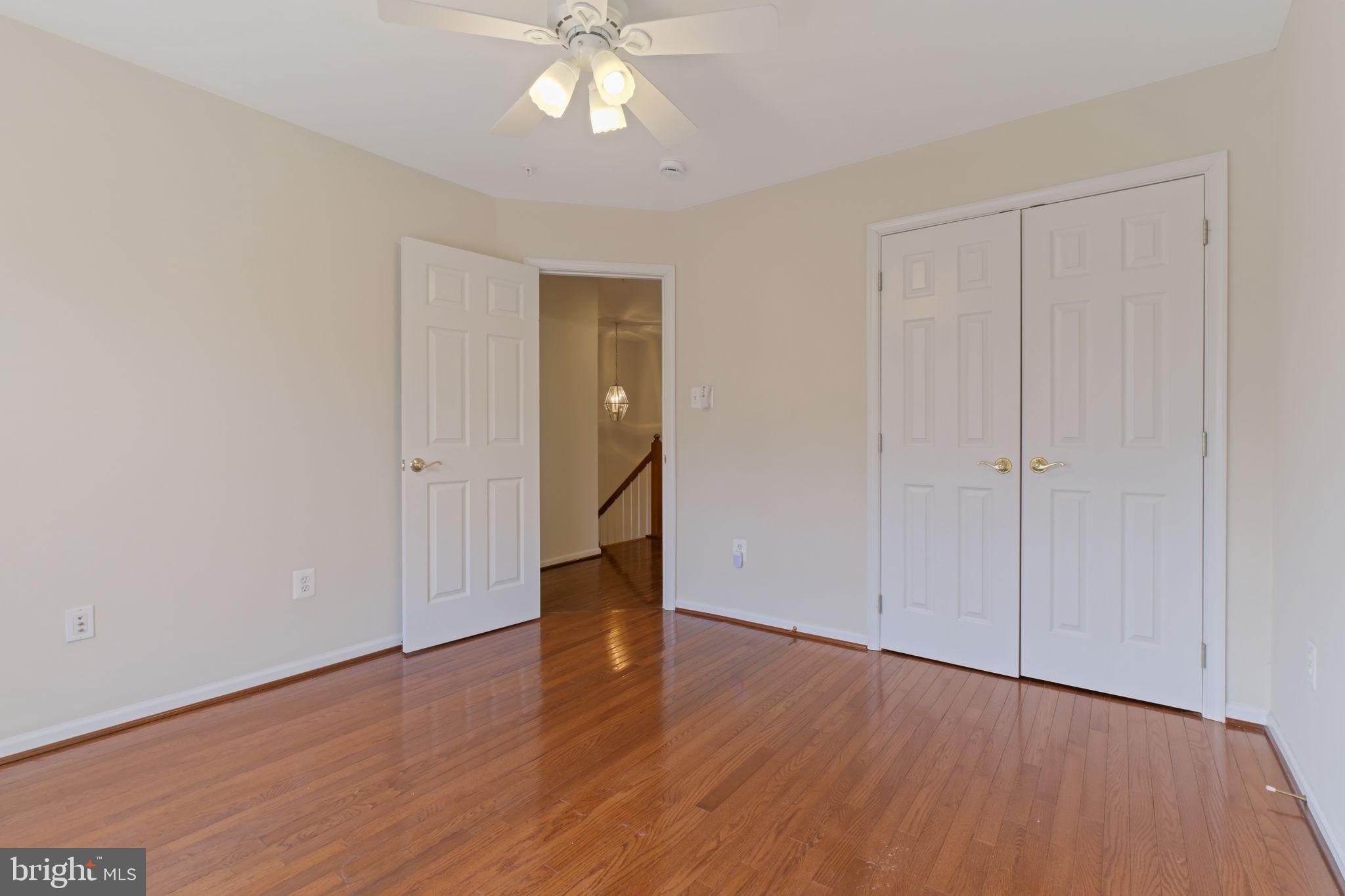 725 Ridgemont Avenue Rockville, MD 20850 - Photo 21 of 30 a view of an empty room with wooden floor