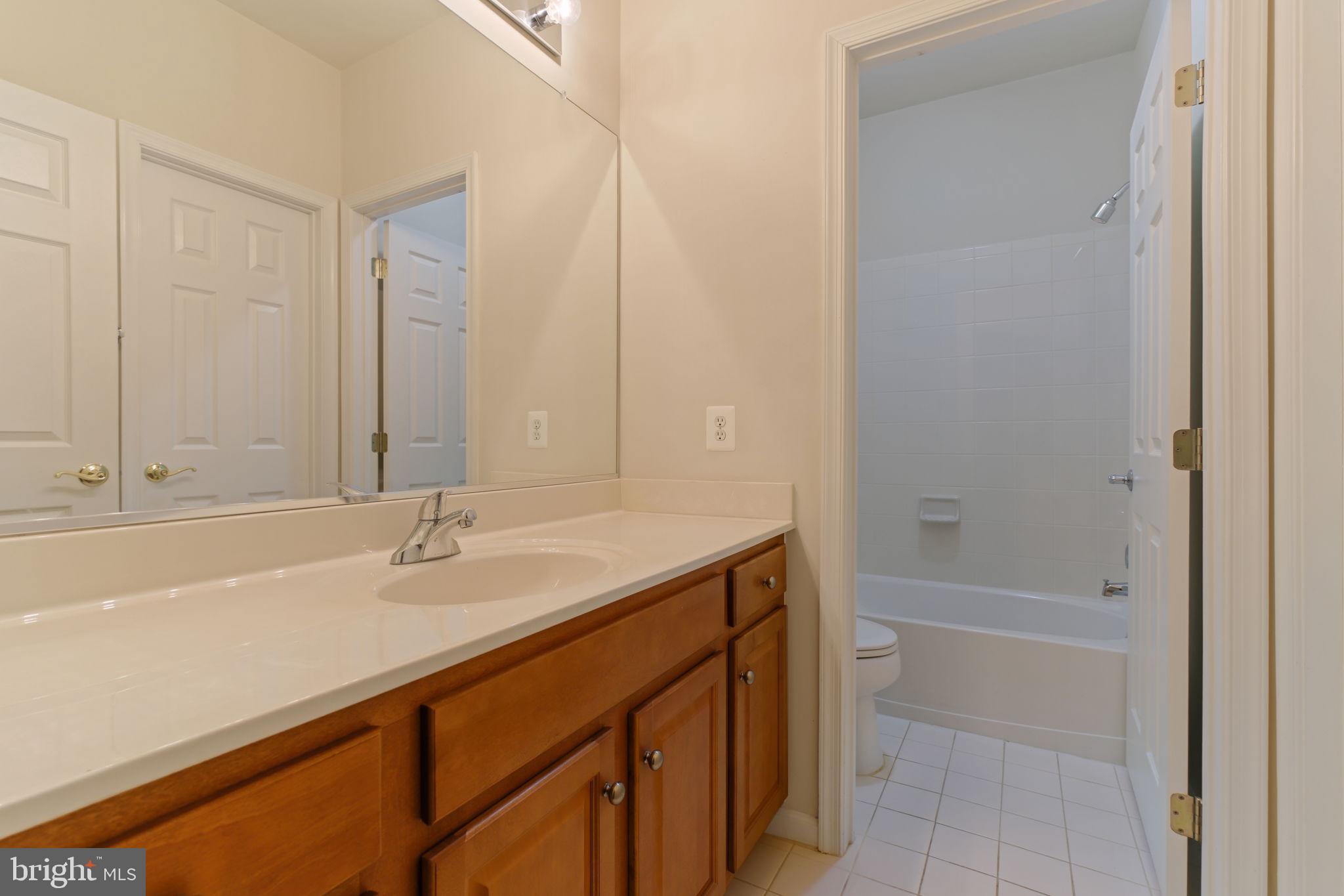 725 Ridgemont Avenue Rockville, MD 20850 - Photo 27 of 30 a bathroom with a sink and a bathtub