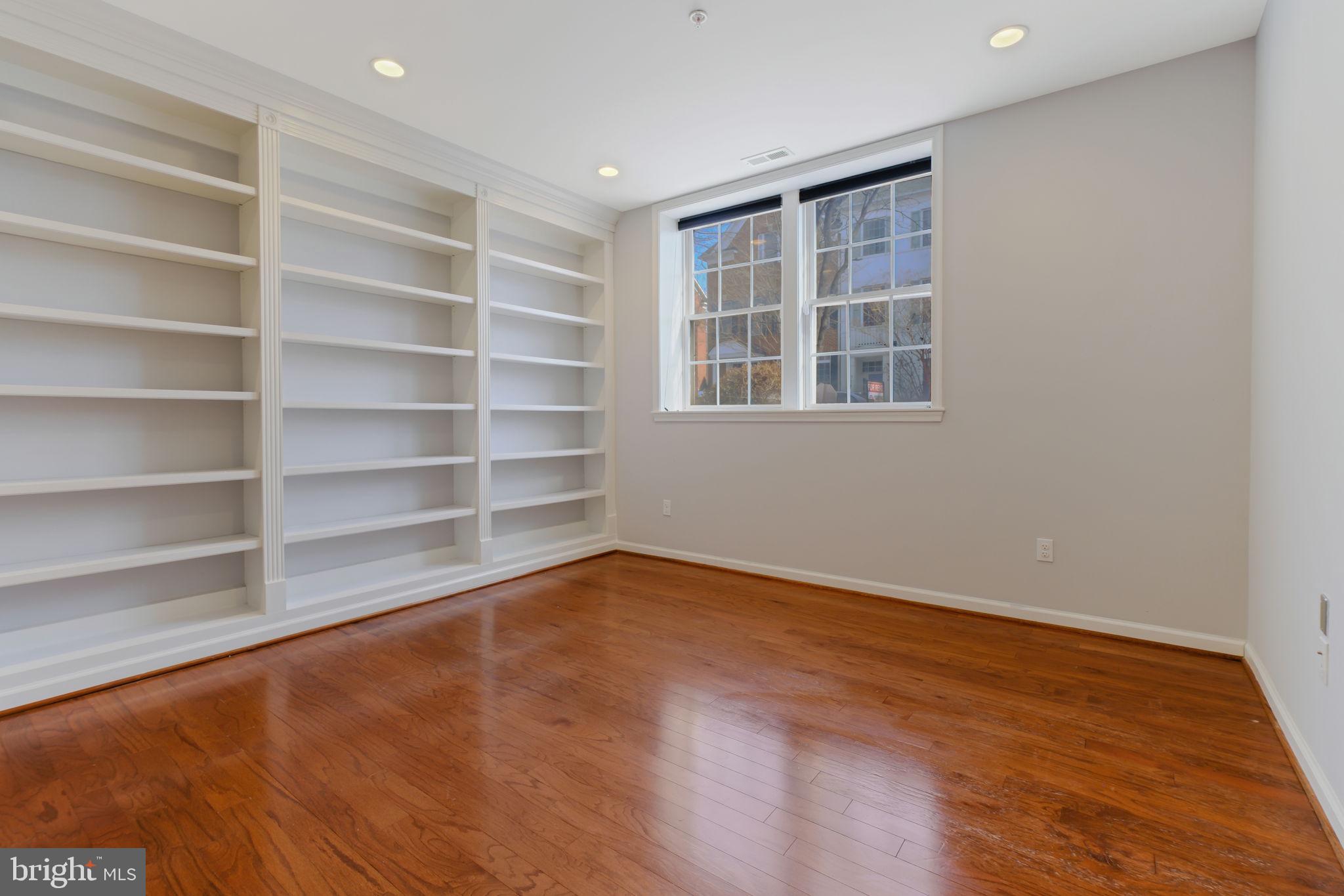 725 Ridgemont Avenue Rockville, MD 20850 - Photo 29 of 30 a view of an empty room with a window and wooden floor