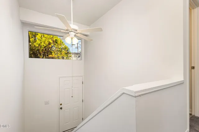 a view of a hallway with a large window