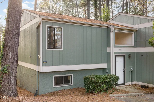 a front view of a house with garage