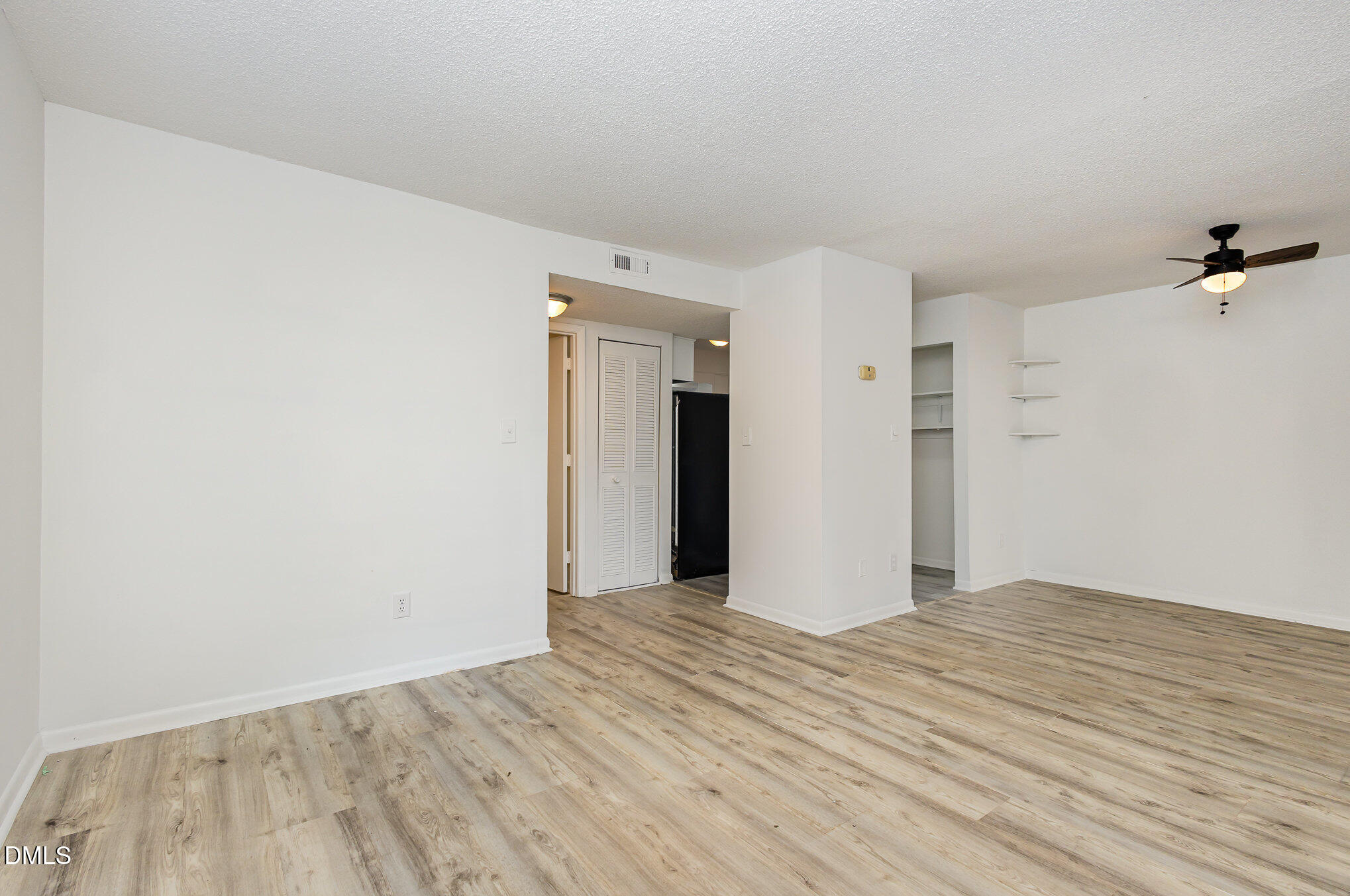 701 Godwin Court Raleigh, NC 27606 - Photo 7 of 29 a view of a room with wooden floor