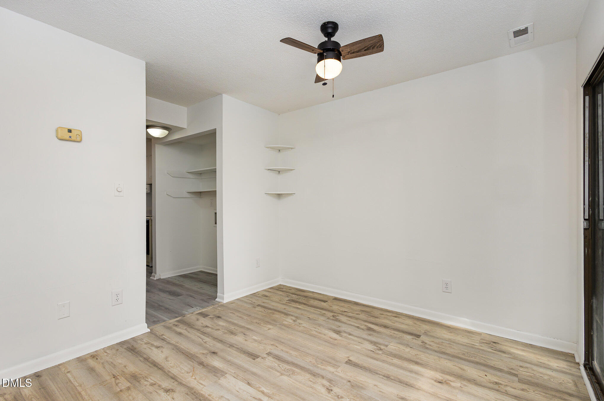 701 Godwin Court Raleigh, NC 27606 - Photo 8 of 29 a view of empty room with wooden floor
