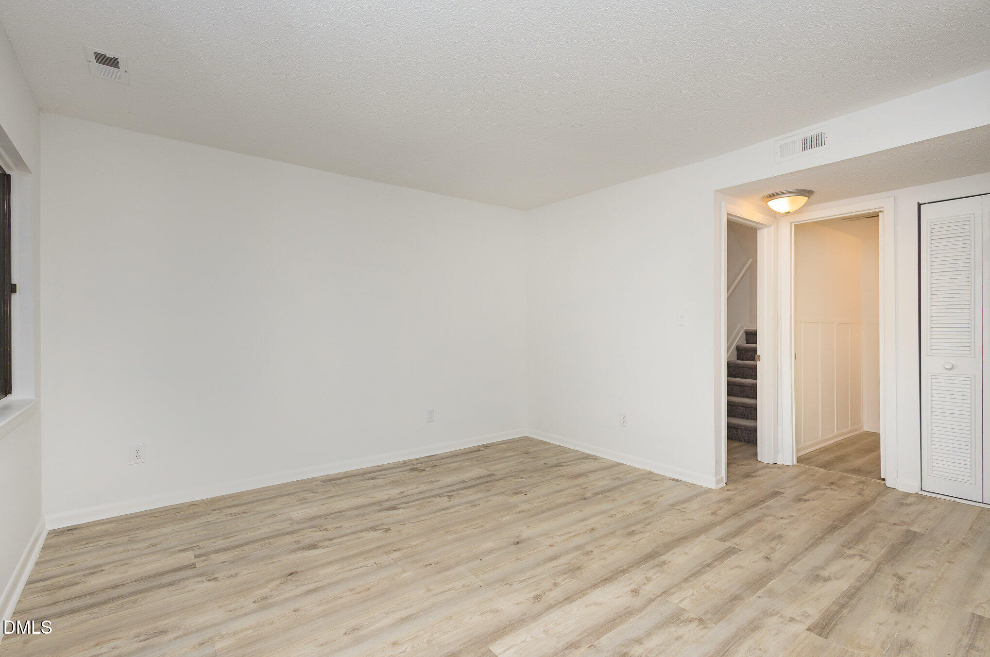 701 Godwin Court Raleigh, NC 27606 - Photo 9 of 29 a view of a room with wooden floor