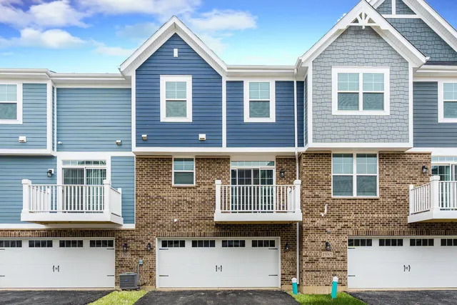 a front view of a house with glass windows